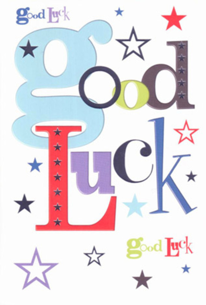 In this photograph, a contemporary good luck card takes centre stage, its design bursting with the same upbeat spirit you might feel walking through Hook on a bright market morning. The card rests on a seamless white background, and against this clean canvas, the phrase "Good Luck" appears in a lively collage of fonts and colours that together form a joyful visual chorus. The most prominent letters are rendered in a wide, pastel blue, their generous curves suggesting friendliness and ease. Threaded between them, narrower letters in charcoal black, confident red, moss green, and velvety purple stack and lean at subtle angles, a bit like stems carefully layered in a florist's hand to create both movement and balance. Around the words, stars of every size scatter like confetti tossed in celebration. Some are sharply defined in navy and deep indigo, others glow more softly in sky-blue, lilac, and whisper-light lavender, with an occasional lime-toned star adding a spark of citrus brightness. The white background is not empty; it acts like breathing space, allowing each colour and shape to stand out clearly, a modern touch that echoes a minimalist card display in an independent Hook gift shop. The printing finish appears smooth and slightly satin, giving the impression that if you brushed your fingers across the surface, you'd feel only a crisp, even texture, no embossing, just solid, confident ink. It feels like the sort of card you'd tuck into a bouquet before delivering it to a doorstep off Griffin Way or along London Road-an encouraging token for someone chasing a dream, about to sit exams, or stepping into a new role, quietly cheering them on with every vivid letter and star.