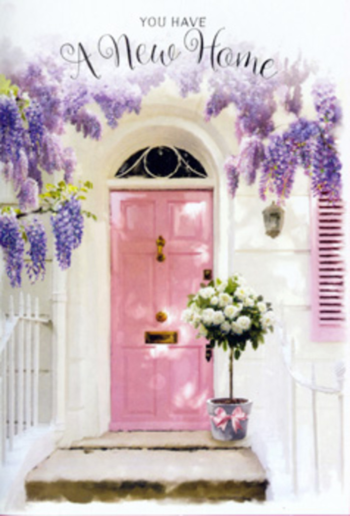 The photograph offers a poetic glimpse of a Hook doorway dressed for a special moment, most likely the arrival at a new home. At the heart of the composition is a soft pink door, painted in a smooth, matte finish that softens the edges and invites the touch. It sits within a frame of whitewashed wall that reflects daylight in a quiet, diffused way, making the colours appear gentle rather than bright. A single shutter, painted in an even softer pastel, hints at a window just out of sight and mirrors the relaxing tones often seen along the residential streets near Hook station. Above the doorway, wisteria spills down in lavish cascades. Its drooping clusters of lavender and light purple flowers create a living curtain, with each tiny bloom contributing to a cloud of colour that arches protectively over the entrance. The effect is romantic and slightly whimsical, evoking the kind of cottage-garden charm that many people in Hook and the surrounding Hampshire countryside cherish. Nestled at the base of the door, right on the doorstep, is a tin bucket brimming with roses. The roses are a creamy white, plush and densely petalled, gathered together to form a rounded, abundant arrangement. Threads of soft green foliage weave through the bouquet, breaking up the creaminess and adding hints of freshness, as if the stems were just cut and arranged that morning. A satin-like ribbon in pale pink is tied around the bucket, its loose tails falling gracefully and picking up the blush of the door. The whole scene is bathed in soft natural light, with delicate shadows marking the steps and corners but never turning harsh. Together, the flowers, colours, and textures express quiet delight and steady reassurance-a floral embrace welcoming someone to their new doorstep in Hook.